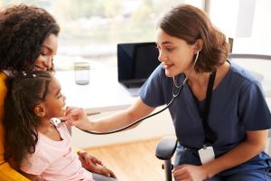 Nurse with young child and mother