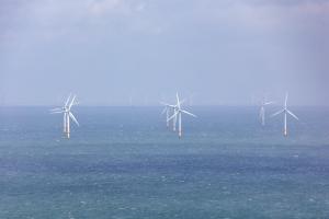 ind farm turbines providing alternative energy in open ocean water. Gwynt y Môr Off the coast of Llandudno, North Wales. United Kingdom