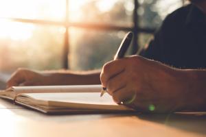Student writing in Notepad