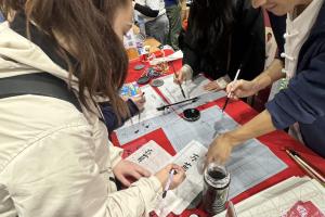 Students trying calligraphy