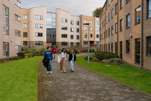 Group of students walking outside in St Mary's village