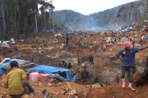 People on an open mine in a forest in Madagascar.