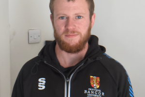 Head and shoulder shot of Mike Morris looking at camera wearing black Bangor University jacket