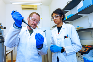 Prof Chris Gwenin and student Jessica Mahajan in the science labs at Abertay University, Dundee.