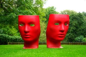 Two Statues of red faces