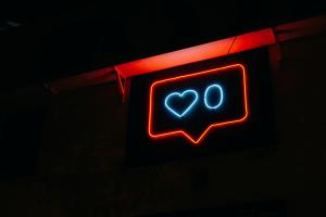 Neon light showing social media zero likes
