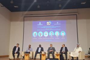Prof Hussainey on stage with colleagues at the editors session in April 2025