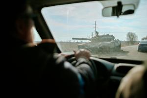Image taken from a car of a war tank