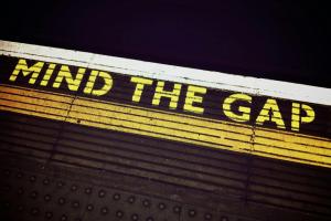 Mind the Gap waring on a platfrom edge