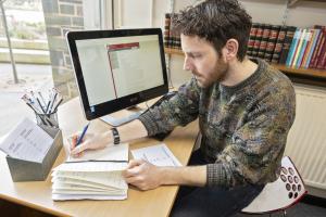 Archives staff member at PC conducting research