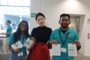 Students showing their Chinese painting art