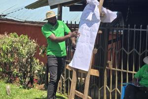Dr. Ronald Sang training farmers on Animal Health Management.