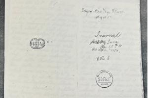 A photograph of a document in an archive with handwriting in black ink, stamped 1854.