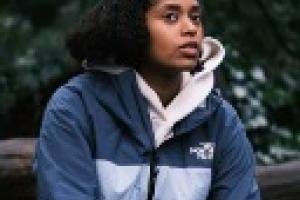 Portrait image of Kwesia X looking away from the camera