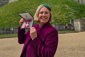 Prof Julia Jones holding her MBE