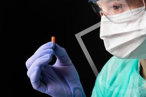 Pharmacist holding a pill