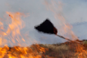 A firefighter tackling a blaze
