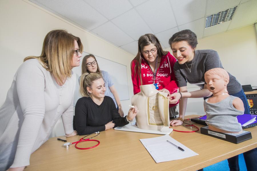 Nursing students in a practical session.