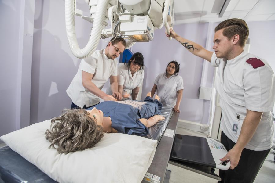 Students training to use an x-ray machine