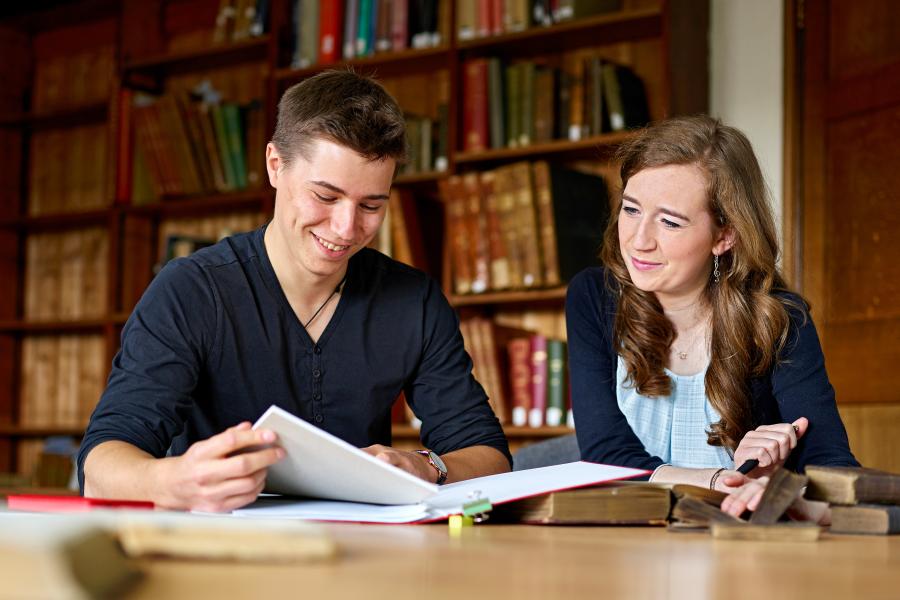 Two students studying at the Main Arts Library