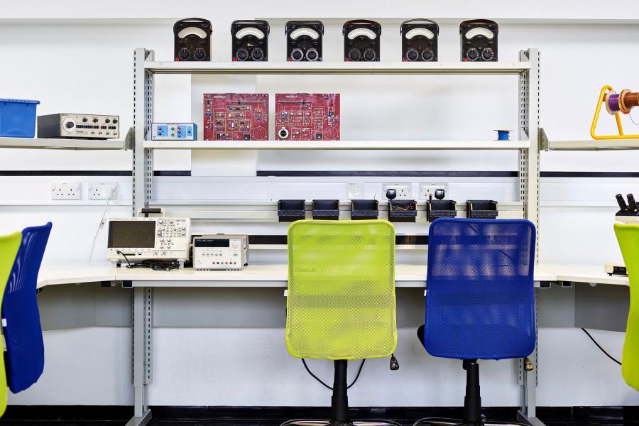 An empty desk at an Electronic Engineering and Computer Science lab