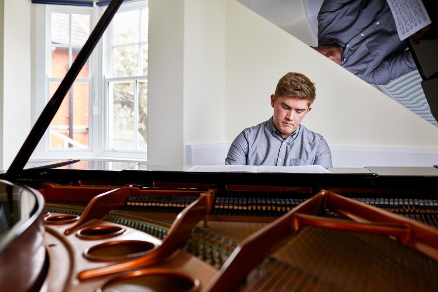 Student playing the piano