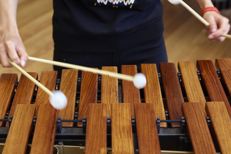 Student playing the xylophone.