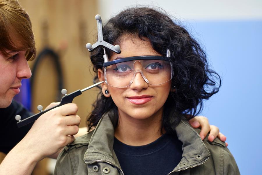 Students carrying out an experiment in the Transcranial Magnetic Stimulation laboratory