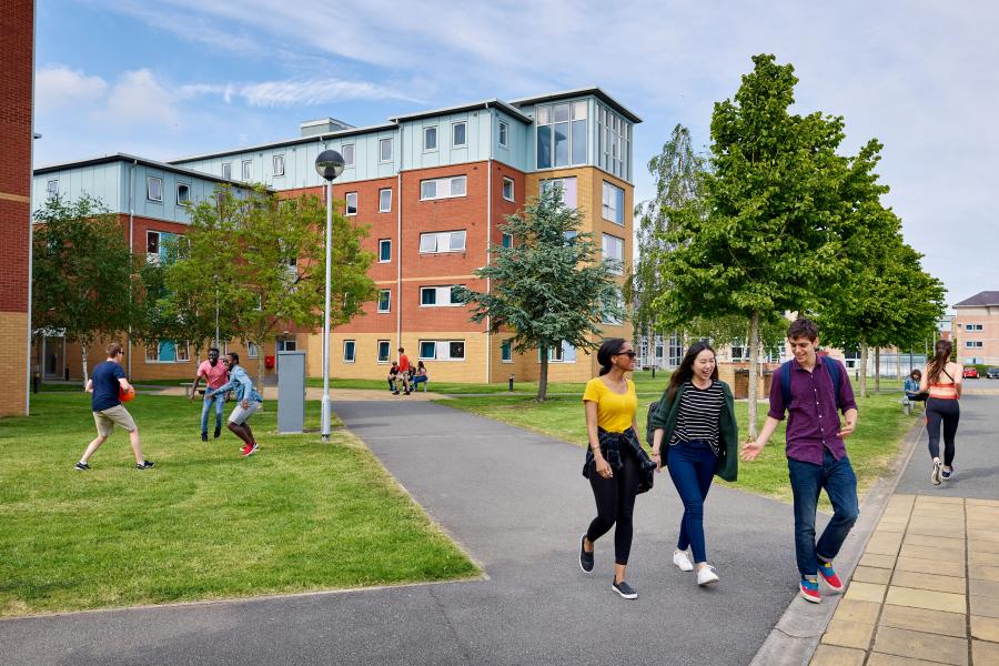 Students walking through Ffriddoedd Student Accommodation