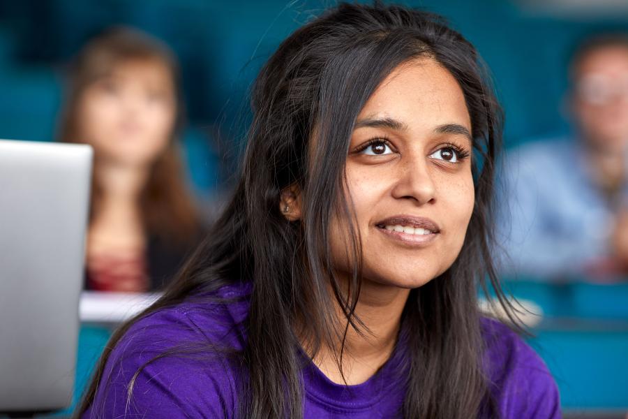 A close up of a student listening in a lecture