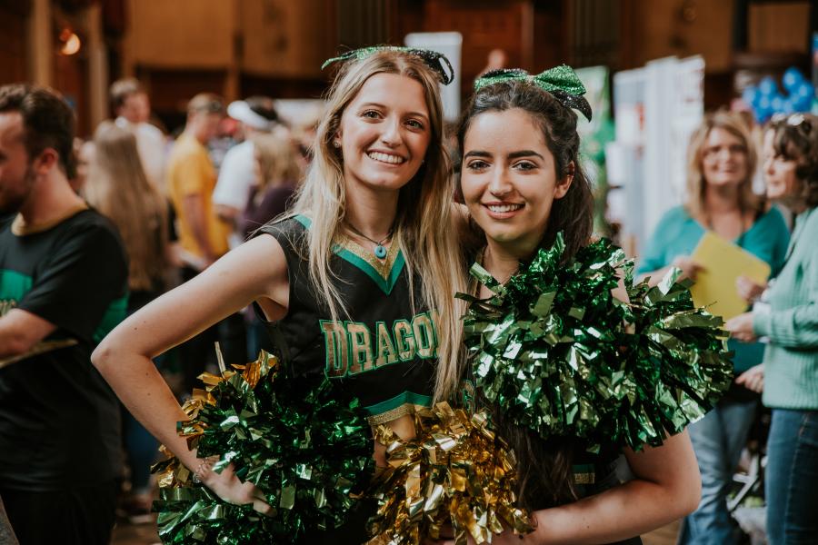 Two cheerleaders at the Serendipity Fair during Welcome Week