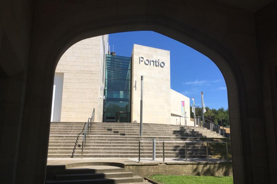 View of Pontio Arts and Innovation Centre through the memorial arch