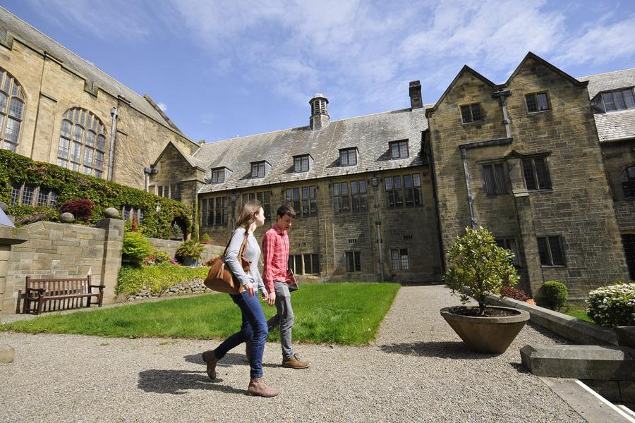 Students walking through the quad of the Main Arts Building