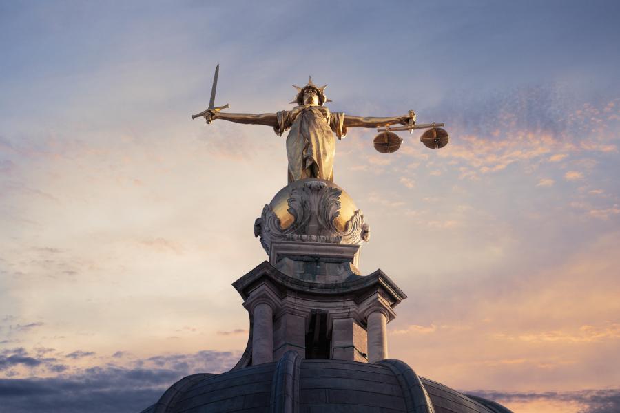 Gold Lady Justice Statue on the top of the Old Bailey in London, UK