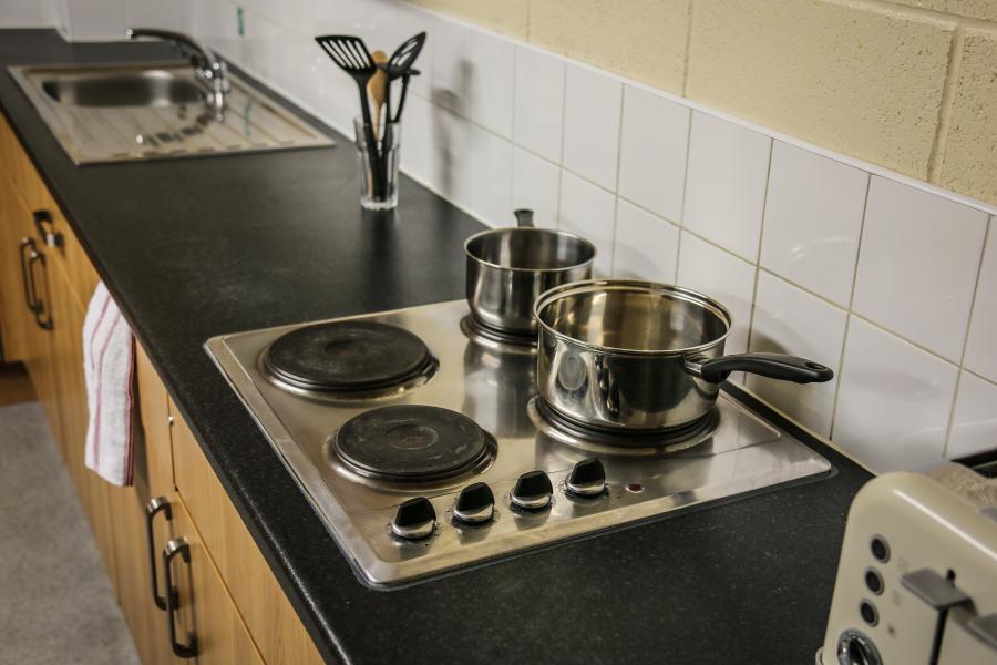 A shared kitchen in Glyder halls of residence at Ffriddoedd Student Village 