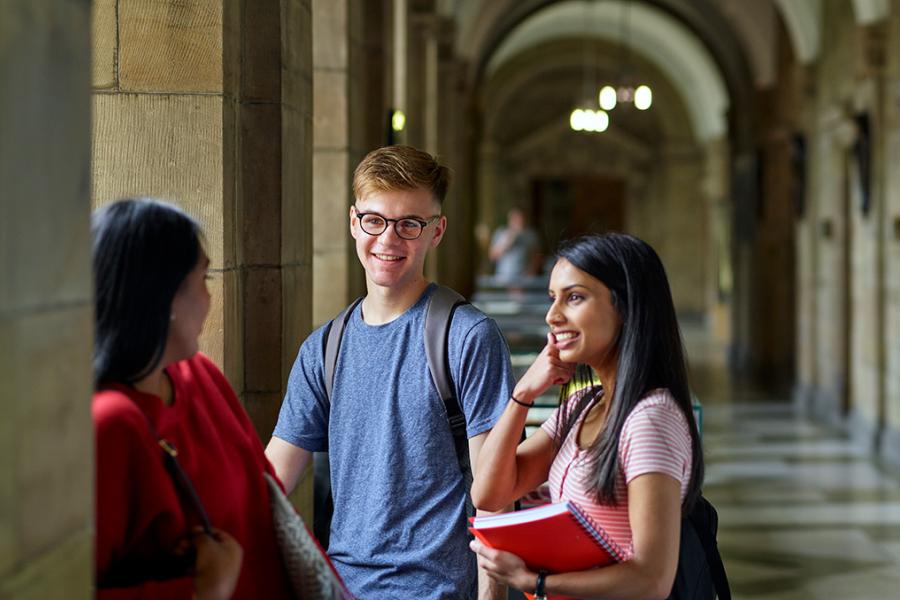 Groups of student talking on Main Arts corridor