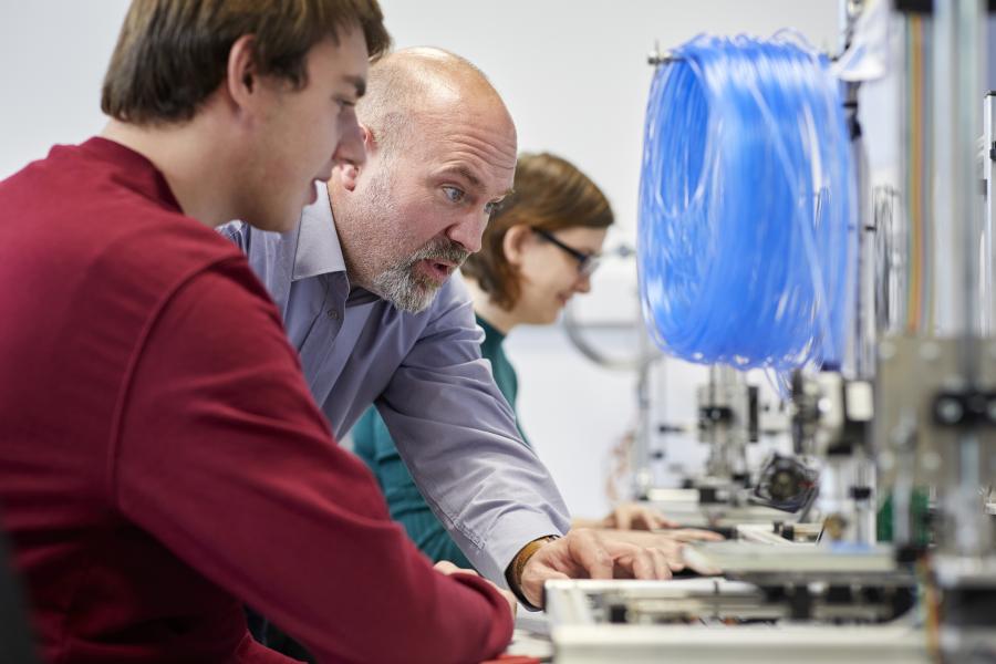lecturer teaching computer science engineering student 