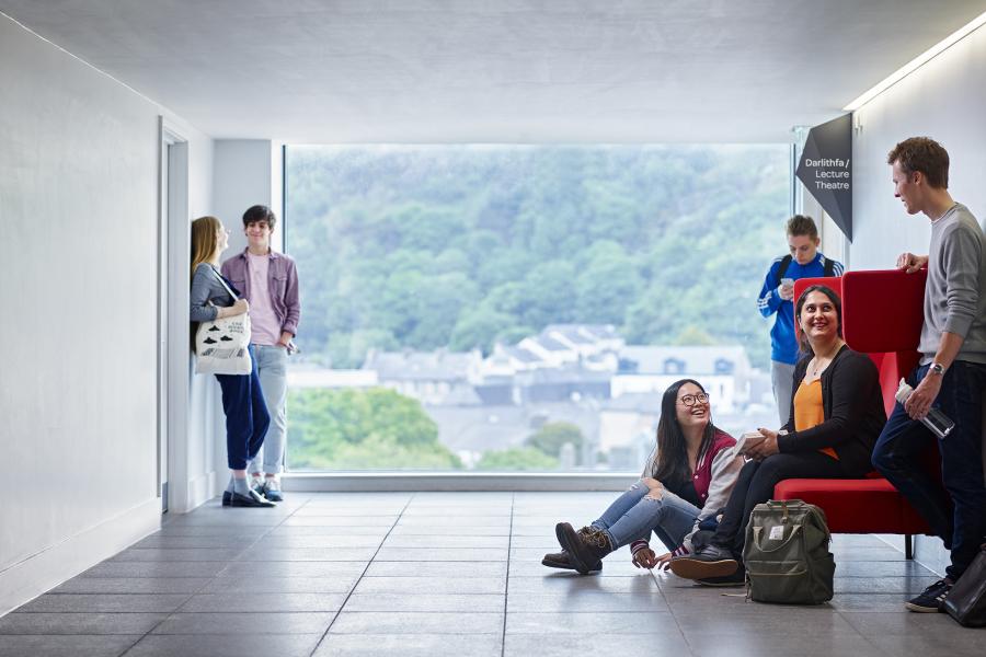 students waiting to go in to a lecture in the Pontio building