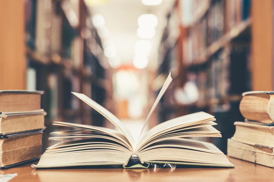 Close-up of an open book in a library