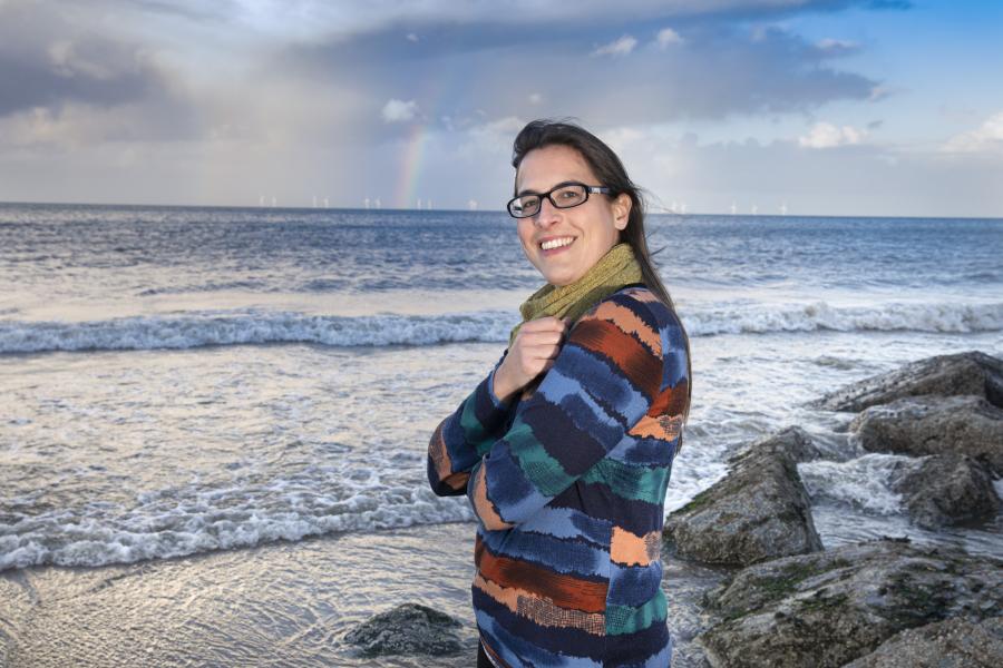 Person with sea in the background