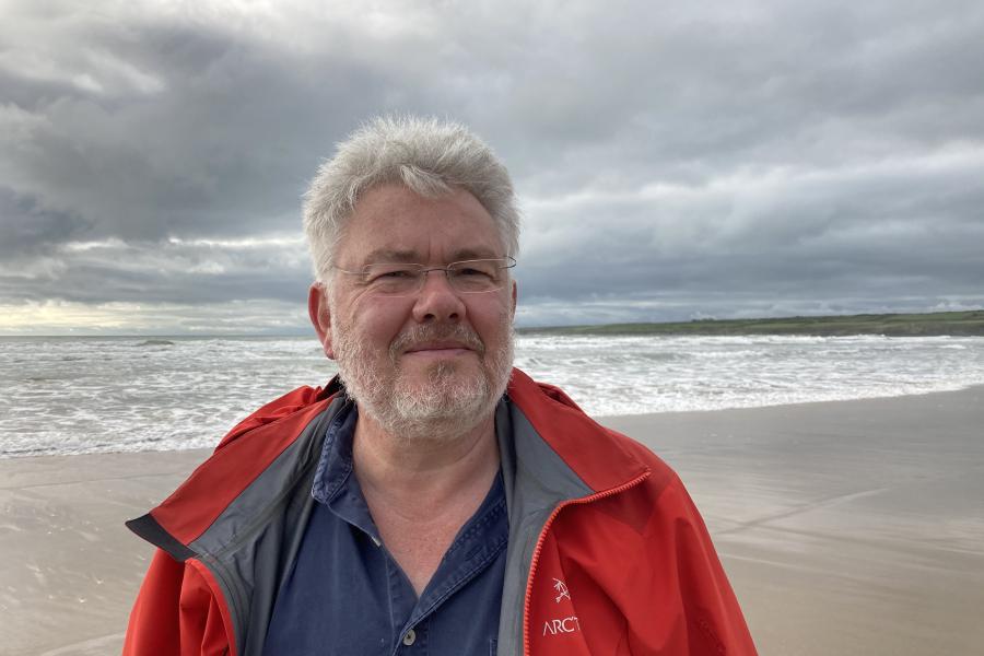 Man standing in front of beach