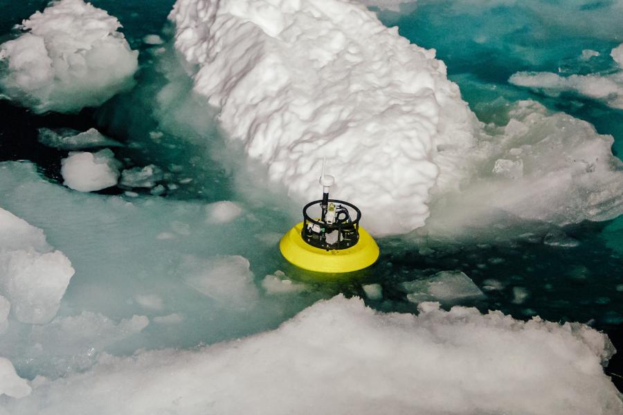 Scientific equipment seen in the water next to a piece of ice berg