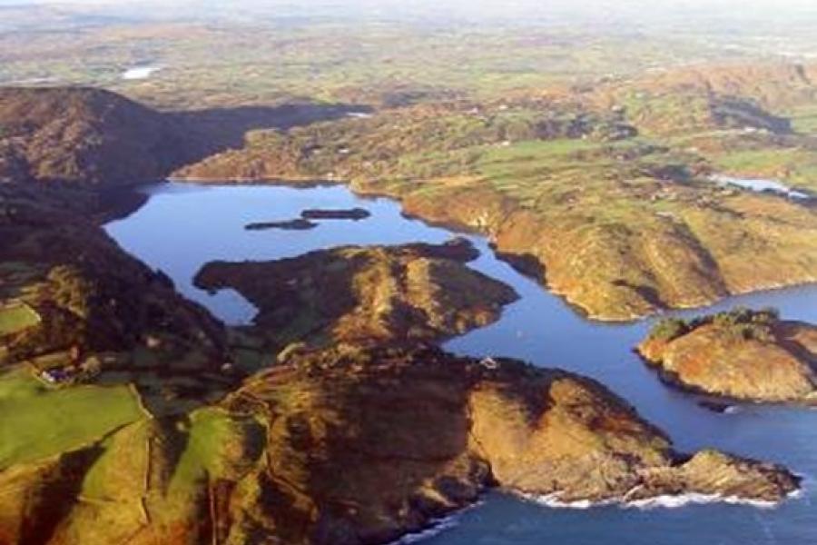 Aerial image of coastline showing a lough