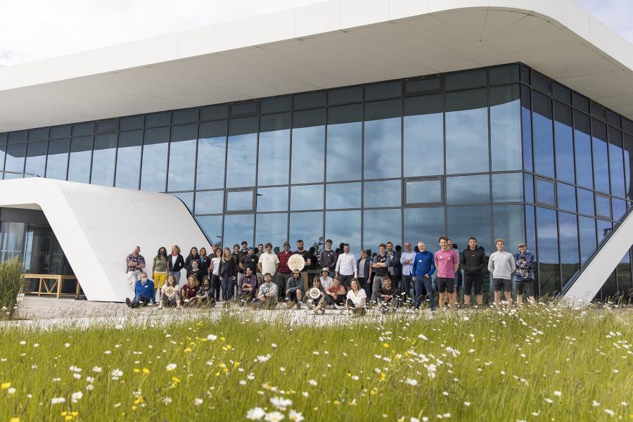 large group of people in front of big building