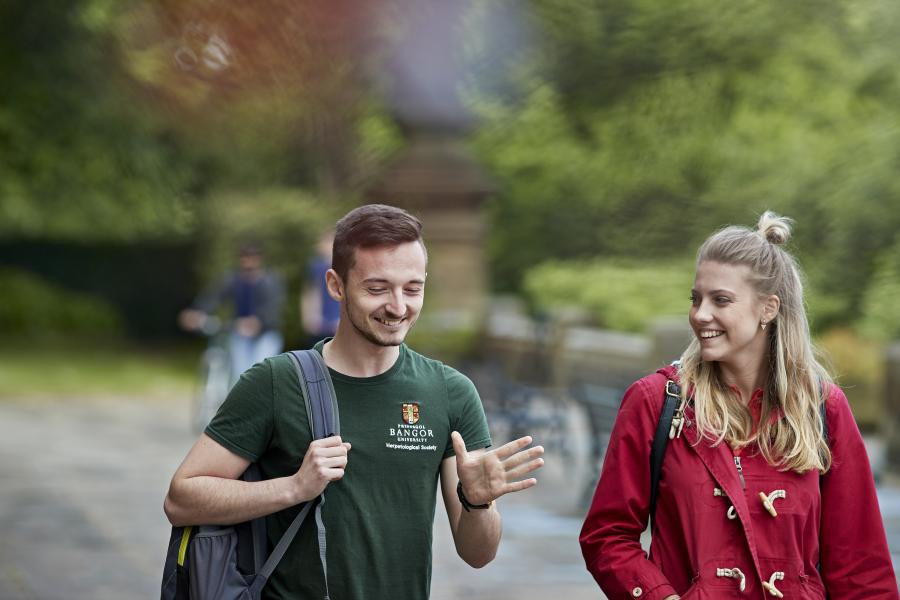 Two students walking on the Main Arts Terrace