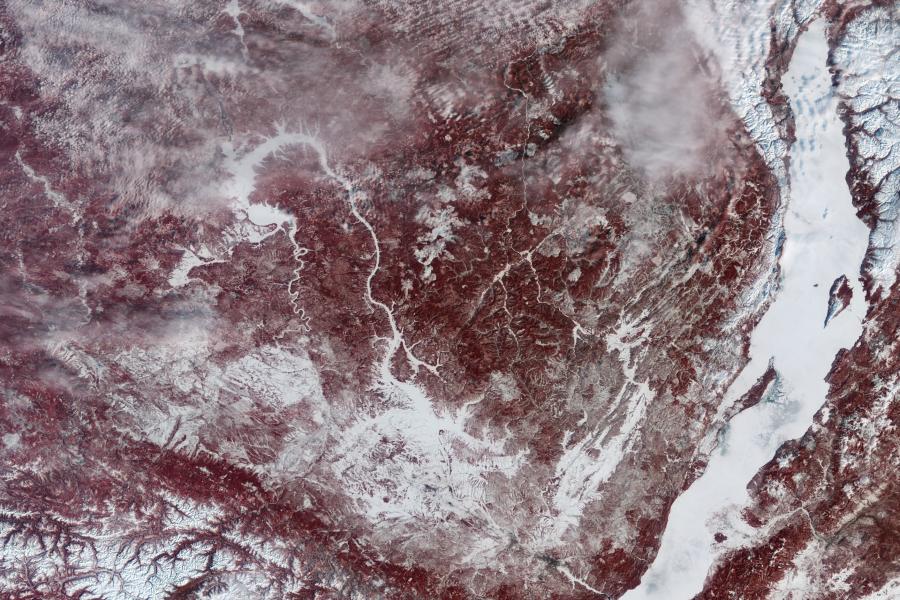 The ice covered Lake Baikal is seen to the right of a satellite image.