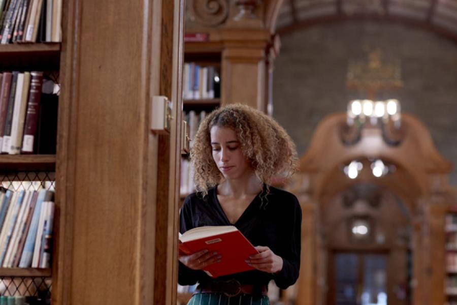 Student reading in the Shankland library