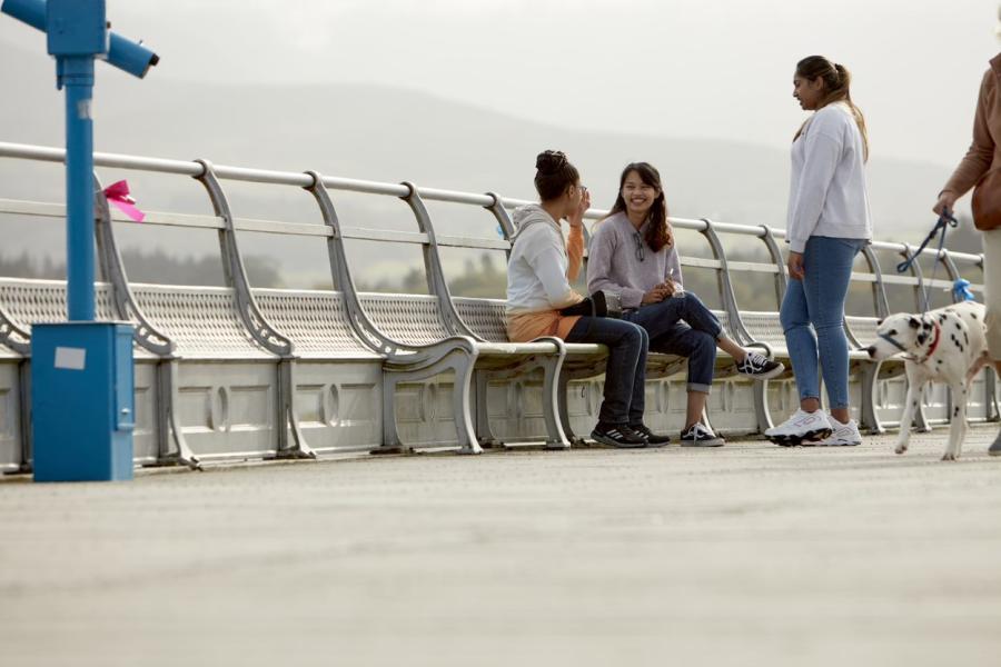 Students socialising on Bangor Pier