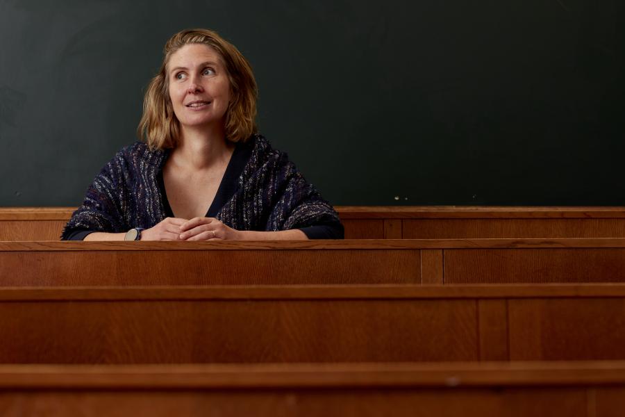 Professor sitting in lecture room