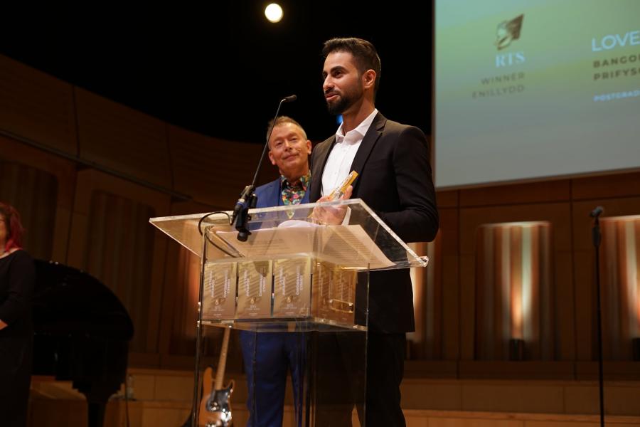 Shafin Basheer on stage receiving his award